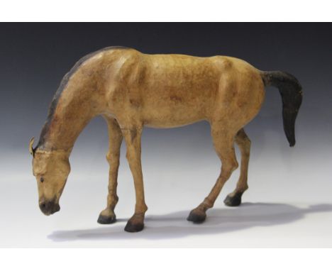 A 20th century leather model of a horse, height 32cm.
