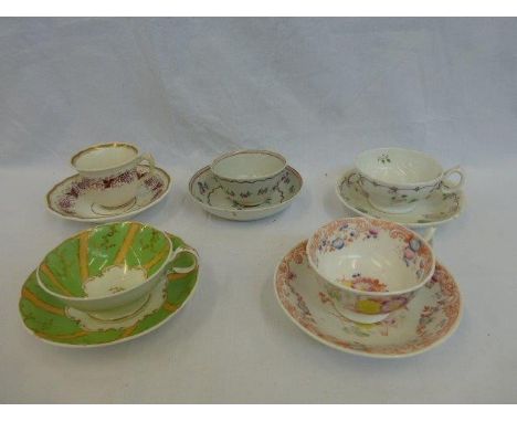 A collection of five 18th Century and later tea cups and saucers including a tea bowl with a matching saucer.