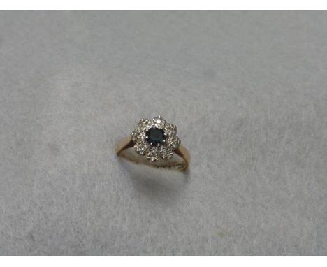 A gold sapphire and diamond cluster dress ring, size K.