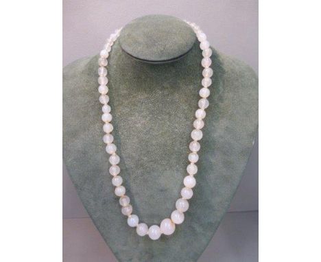A white agate/jade beaded necklace of 56 graduating beads.