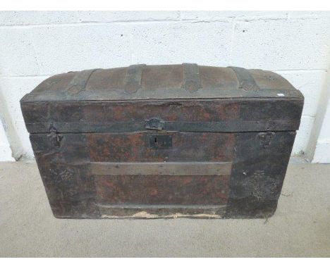 A Georgian oak and tin-clad dome-topped trunk with original paintwork.