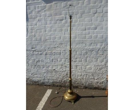 A Victorian brass standard lamp.