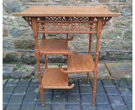 An Arts and Crafts Anglo-Japanese light oak pagoda table by Heal & Son.