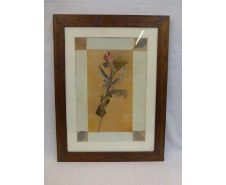 A framed block print decorated with a flower stem and leaves, overlaid with gold leaf and silver leaf, unsigned.