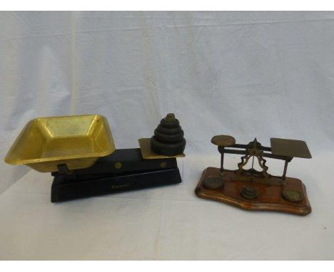 A set of post office scales and weights and a set of Waymaster scales and weights.