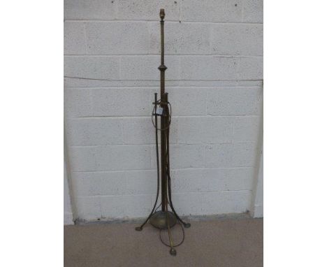A brass Art Nouveau standard lamp.