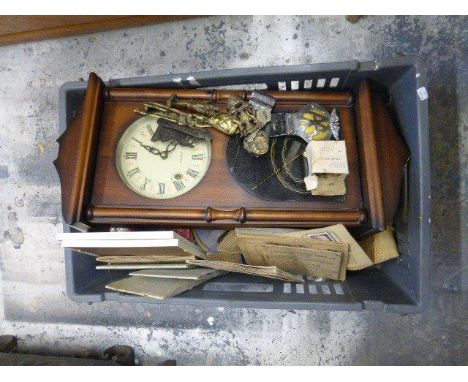 A box of assorted collectables including ration books, wall clock, cigarette cards, brass door knockers, etc.