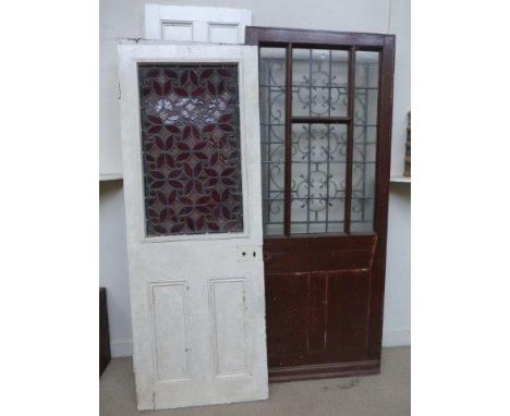 An assortment of five internal and external doors, including a 19th Century door with a leaded coloured glass panel.
