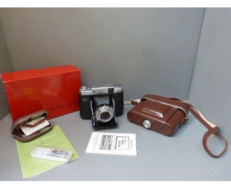 A boxed Zeiss Ikon, Super Ikonta camera with original instruction manual, in good condition.