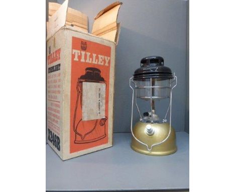 A boxed and unused Tilley storm light.