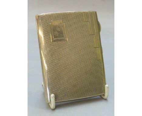 A silver cigarette case with engine turned decoration, maker SML Ltd., Birmingham 1938.