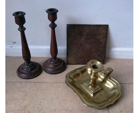 A 19th Century etched brass sundial plate, brass chamber stick and a pair of candlesticks.