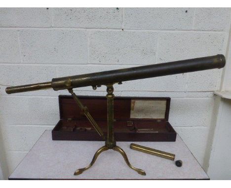 A 19th Century lacquered brass telescope on a tripod stand, set within a mahogany case, the collar engraved Gilbert & Wright,
