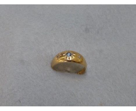 An 18ct gold sapphire and diamond gypsy ring, size N.