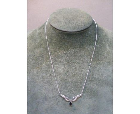 A 9ct white gold, diamond and sapphire pendant necklace.