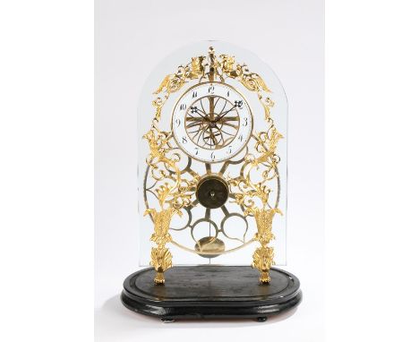 Lacquered brass great wheel skeleton clock, the enamel dial with Arabic numerals, with glass back plate on pierced lacquered 