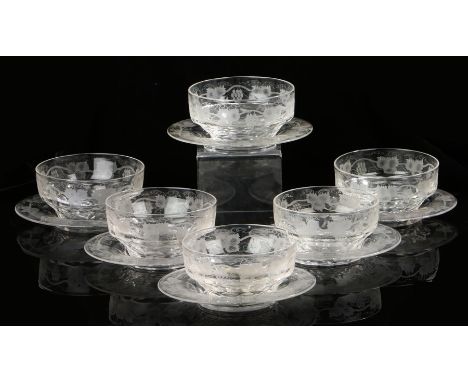 Set of six Victorian glass finger bowls and saucers, with grape and flower etched decoration, the saucers 18cm wideOne of the