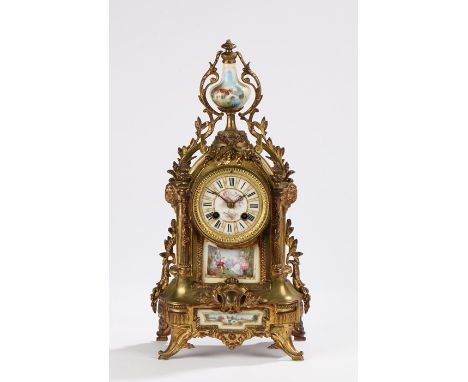 French Ormolu mantel clock, the vase form porcelain pediment with cottage decoration, the dial with Roman numerals and painte