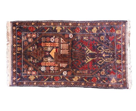 Middle Eastern carpet, the blue ground with foliate and scroll decoration, 86cm x 153cmSlight surface fading and wear