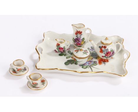 Ludwigsburg miniature porcelain tea set, to include tea pot, jugs, cups and saucers a lidded bowl and tray, (9)