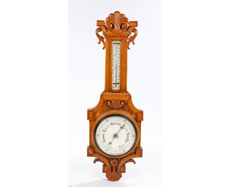 Early 20th Century oak barometer, the arched cornice above a mercury thermometer and circular weather gauge, 88cm high