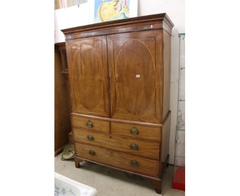 Early 19th century Mahogany Inlaid Linen Press, the upper section with twin doors opening to five linen slides, over a base o