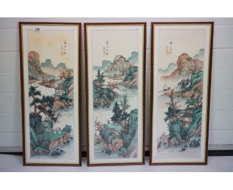 Set of Three Chinese Landscape Paintings on Silk depicting Figures, Boats, Lakes and Mountains, each with red seal marks and 