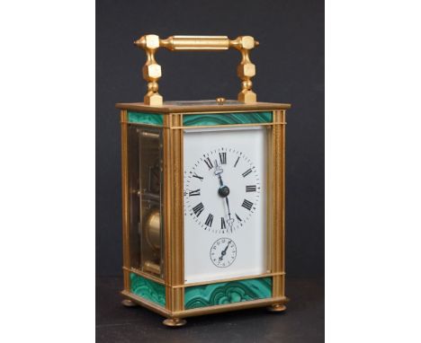 A vintage French made carriage clock with repeating movement, brass cased with decorative malachite panels. 