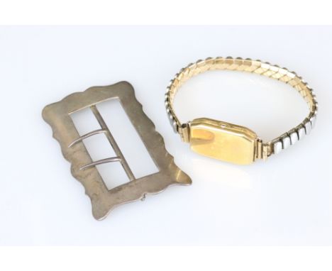 A fully hallmarked sterling silver buckle together with a 9ct gold watch case. 