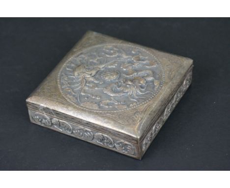 Chinese Silver Cigarette Box, unsigned, the hinged lid chased with a dragon and phoenix amongst cloud bands, 9cm x 9cm 