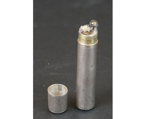 A early 20th century white metal trench style lighter marked Dunhill. 