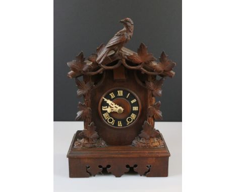 Late 19th / Early 20th century Black Forest Bracket Cuckoo Clock, the case partially carved with oak leaves and a bird, the d