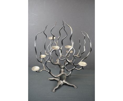 A contemporary cast iron tea light holder in the form of a tree. 
