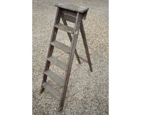 A set of mid 20th century folding step ladders, stand approx 140cm in height. 