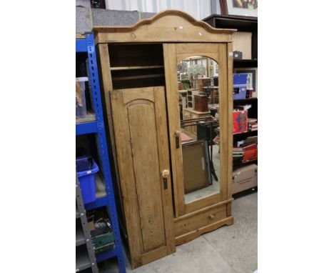 Continental Pine Wardrobe with mirrored door and panel door opening to a shelf above a hanging space, with drawer below, 116c