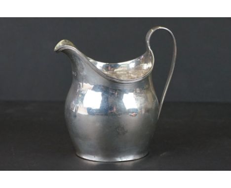 A fully hallmarked sterling silver Georgian cream jug with a London assay mark. 