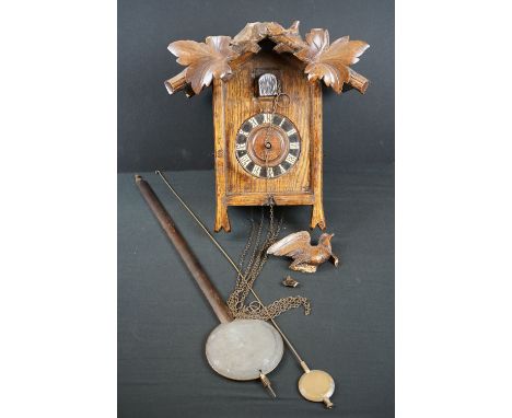 A wooden cased wall hanging cuckoo clock 