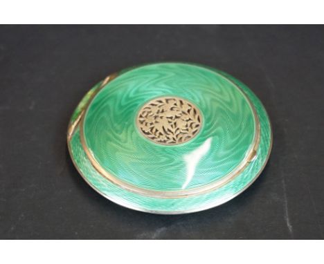 An early 20th century 935 silver and green guilloche enamel powder compact.
