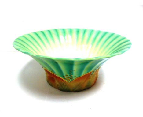 A ROYAL WORCESTER BOWL  circa 1933, with a fluted, flared rim and a band of Art Deco style leaves to the sides, finished in s