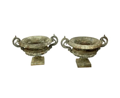 Pair Vintage Cast Iron Garden Planters. Stamped Mexico. Measures 21" H x 30" W. Condition: Typical patina from outdoor placem