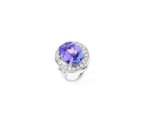 AIGL Certified 7.0 Carat Oval Cut Tanzanite, .70 Carat Diamond and 14 Karat White Gold Ring. Tanzanite with vivid saturation 