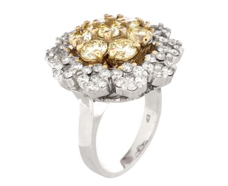 Approx. 5.50 Carat TW Diamond and 18 Karat White Gold Cluster Ring. Set with 4.0 Carat Fancy Light Yellow Round Brilliant Cut
