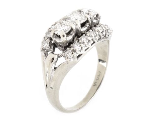 Retro Circa 1940s Approx. 1.25 Carat Round Brilliant Cut Diamond and 14 Karat White Gold Three Stone Ring. Diamonds G-H color