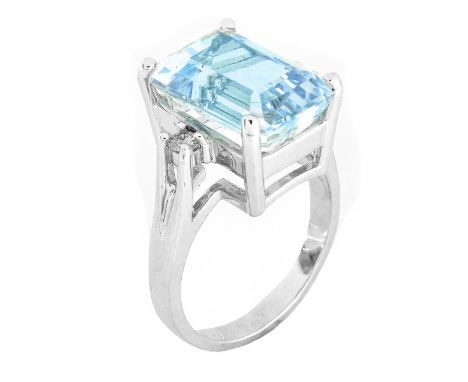 Emerald Cut Aquamarine, Diamond and 14 Karat White Gold Ring. Aquamarine measures 13.5 x 9.5mm. Stamped 14K. Ring size 7. App