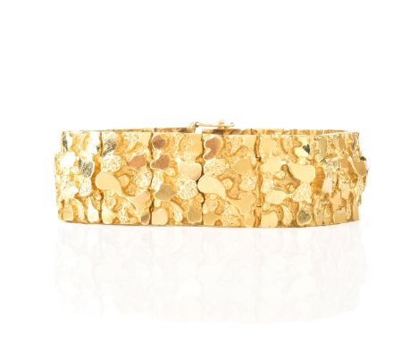 Man's Vintage Thick and Heavy 14 Karat Yellow Gold Nugget Bracelet. Stamped 14K. Measures 8" L, 3/4" W. Approx. weight: 91.4 