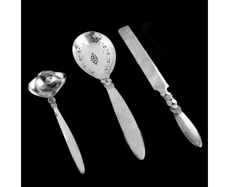 Three (3) Georg Jensen Cactus Sterling Serving Pieces. Includes: serrated cake knife 12-1/4", pierced serving spoon, sauce la