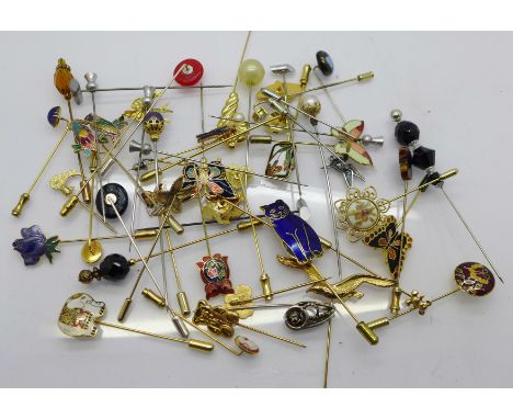 Fifty hat and stick pins including enamel 