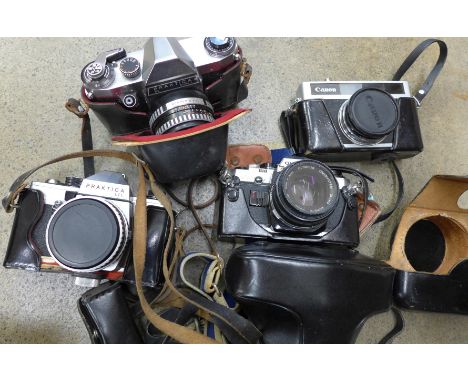Four cameras, Olympus, Canon and Praktica x2 