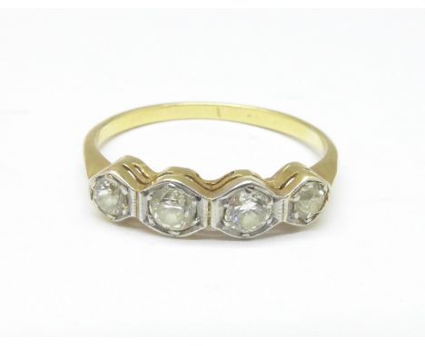 A yellow metal four stone diamond ring, tests as 18ct gold, 1.3g, K 