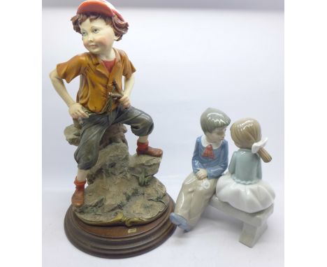 A Capodimonte figure, The Catch, by G Armani and a Nao figure of a boy and girl sitting on a bench 